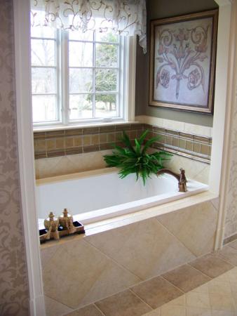 Elegant bathtub with plant and tile in the Washington Metropolitan Area
