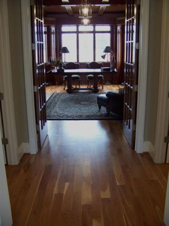 Wooden floor leading to a study.