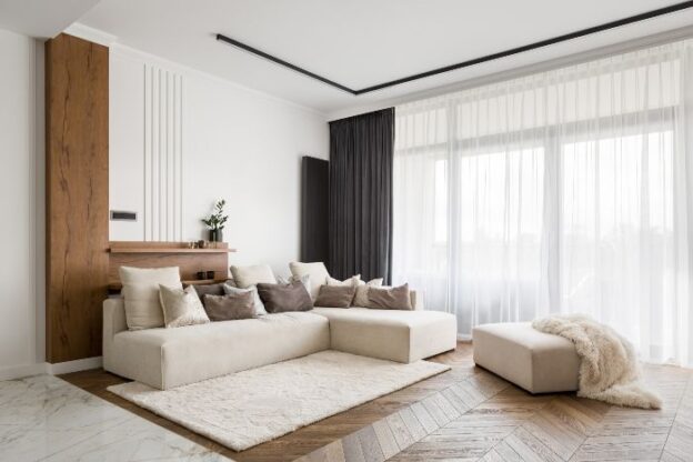 Modern living room with beige sectional sofa.