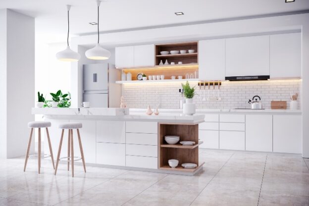 Modern white kitchen with island and stools.