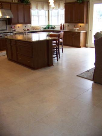 Kitchen island and beige tile floor.