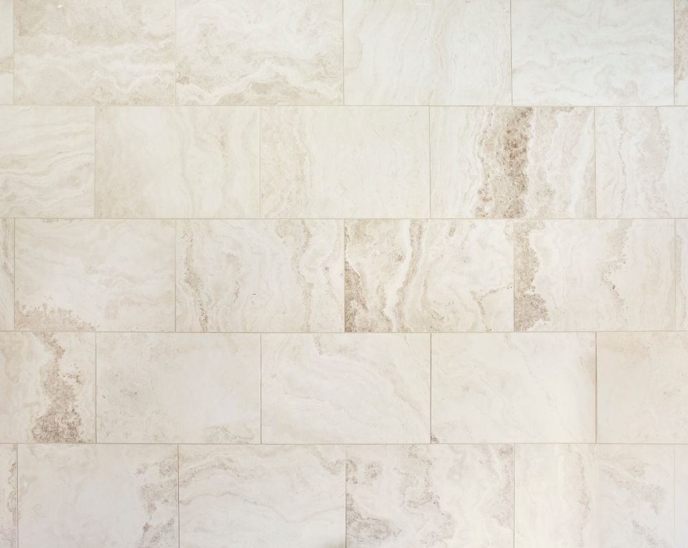 Off-white marble tile wall texture.