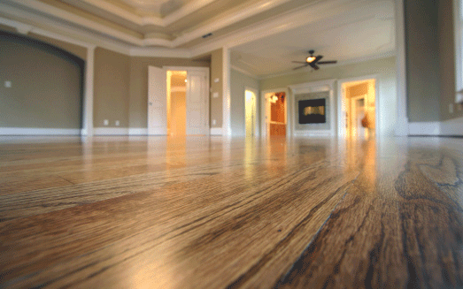 Shiny hardwood floor in a large room.