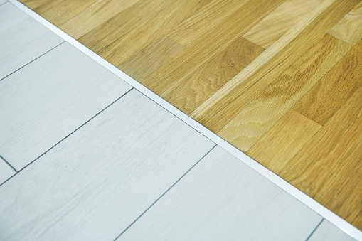 Wood and tile flooring transition.
