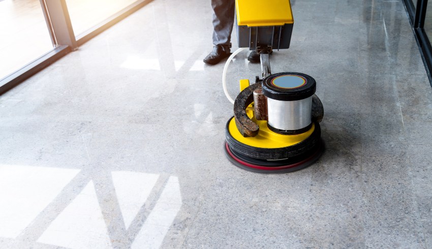 Polishing the concrete floor with a professional floor machine by Elegant Floor Services