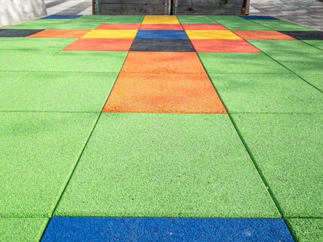 Colorful rubber playground flooring tiles installed by Elegant Floor Services