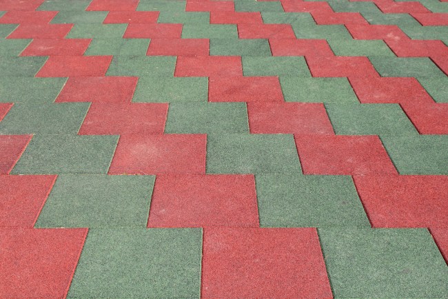 Red and green rubber tile floor installed by Elegant Floor Services